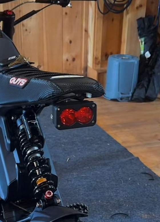 Rear suspension and tail light of a built e-moto bike in a home garage